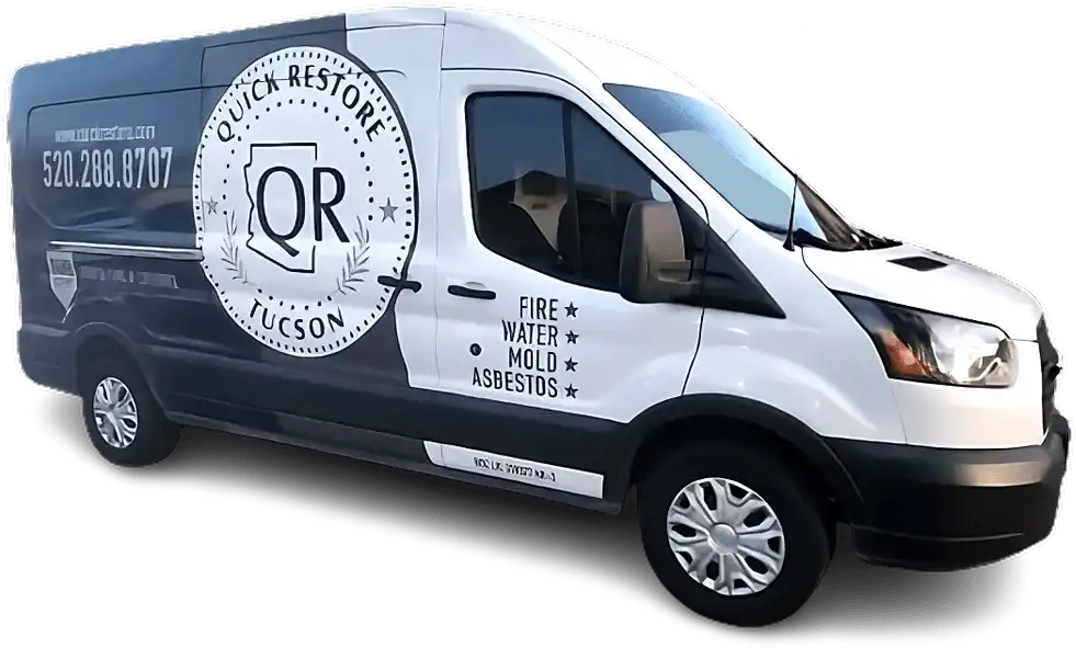 A black and white Quick Restore Tucson service van with contact info and restoration services listed. water damage restoration in Tucson water damage restoration in Tucson